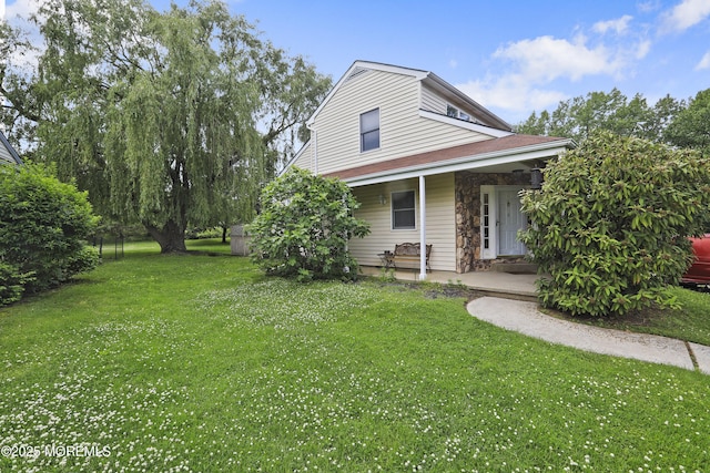 exterior space featuring a yard and covered porch