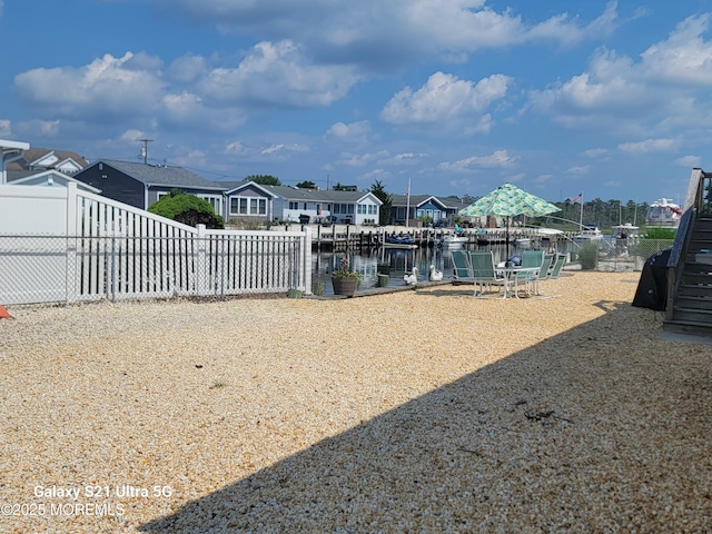 903 Shenandoah Dr, Forked River, NJ 08731 - view of yard featuring a water view, a boat dock, and a residential view