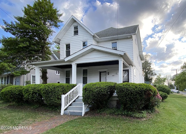 401 Morgan Ave, Palmyra, NJ 08065 - view of front of house with covered porch, a front lawn, and a shingled roof