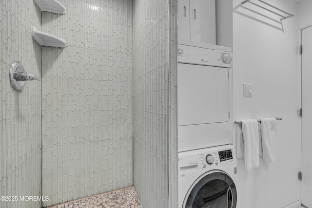 laundry room with stacked washer / dryer and laundry area