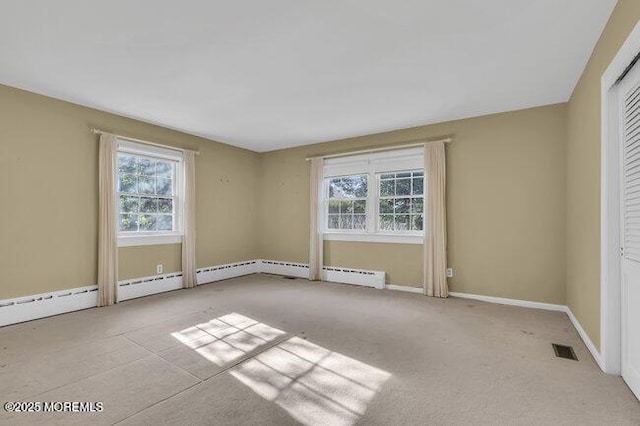 interior space with baseboards and visible vents