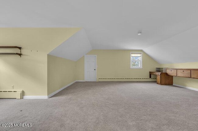 bonus room featuring baseboards, carpet, vaulted ceiling, and baseboard heating