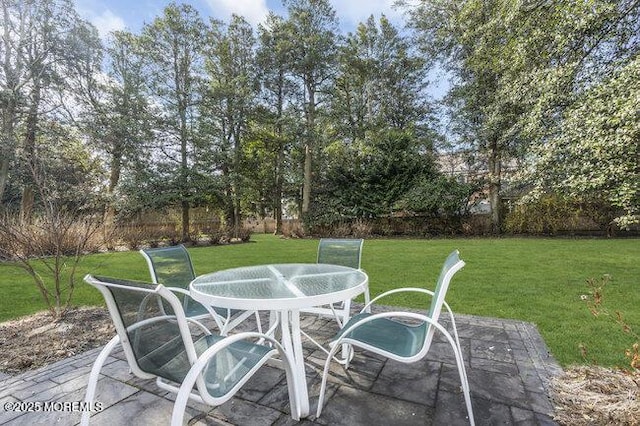 view of patio / terrace with outdoor dining area and fence