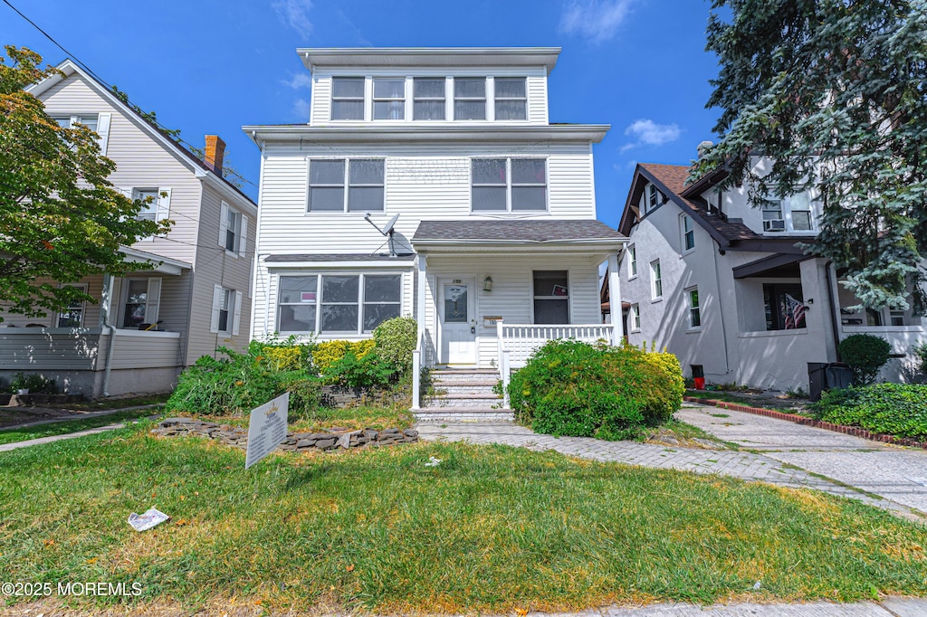 195 Main St, South River, NJ 08882 - american foursquare style home with a front lawn and a porch