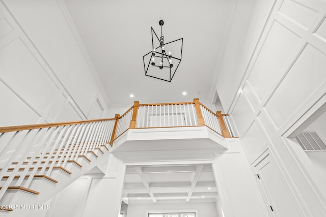11 Beacon Hill Rd, Atlantic Highlands, NJ 07716 - staircase with recessed lighting, ornamental molding, coffered ceiling, beam ceiling, and a chandelier