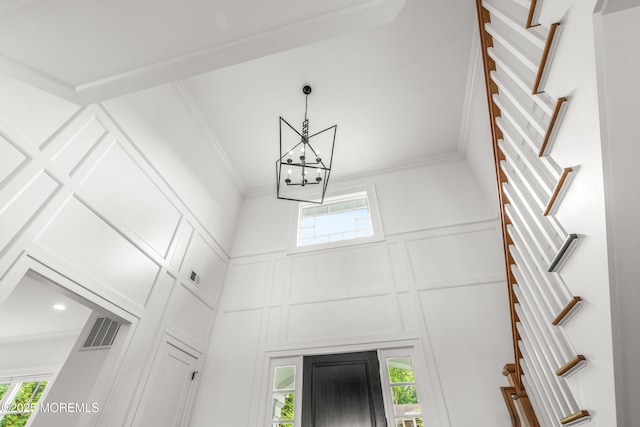 11 Beacon Hill Rd, Atlantic Highlands, NJ 07716 - detailed view of a decorative wall, a chandelier, and crown molding