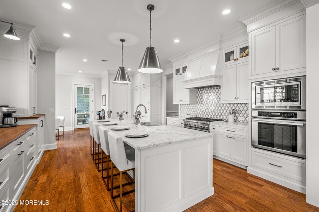 11 Beacon Hill Rd, Atlantic Highlands, NJ 07716 - kitchen with stainless steel appliances, a sink, crown molding, white cabinets, and tasteful backsplash