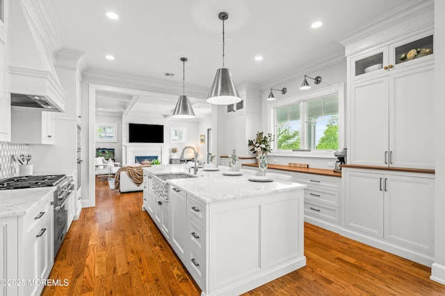 11 Beacon Hill Rd, Atlantic Highlands, NJ 07716 - kitchen with high end stove, a sink, open floor plan, white cabinets, and recessed lighting