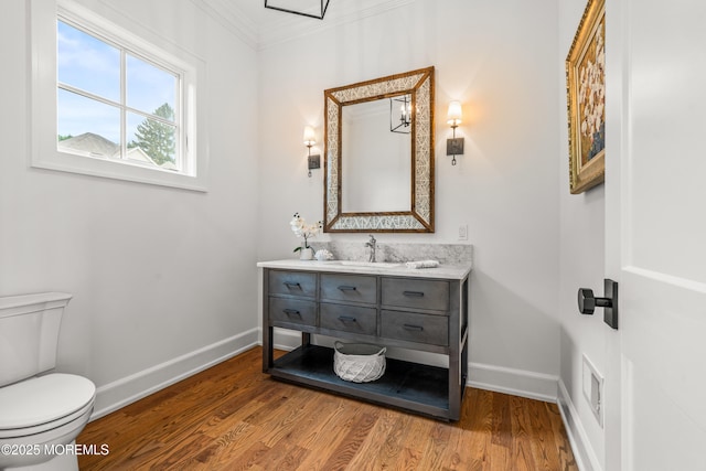 11 Beacon Hill Rd, Atlantic Highlands, NJ 07716 - half bath featuring baseboards, crown molding, wood finished floors, toilet, and vanity
