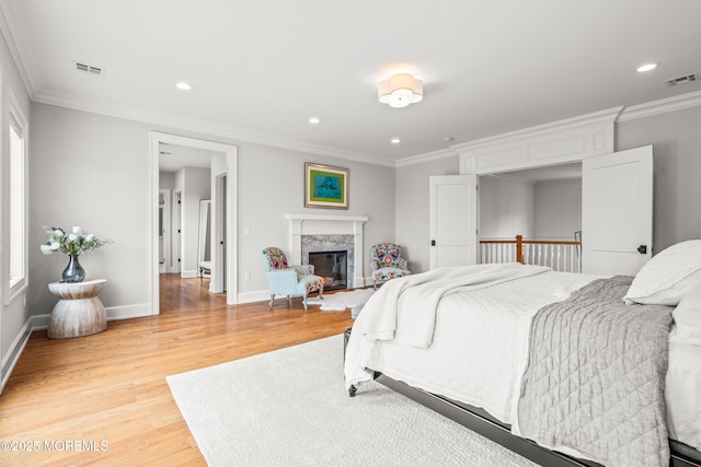11 Beacon Hill Rd, Atlantic Highlands, NJ 07716 - bedroom with light wood-style floors, ornamental molding, recessed lighting, a fireplace, and baseboards