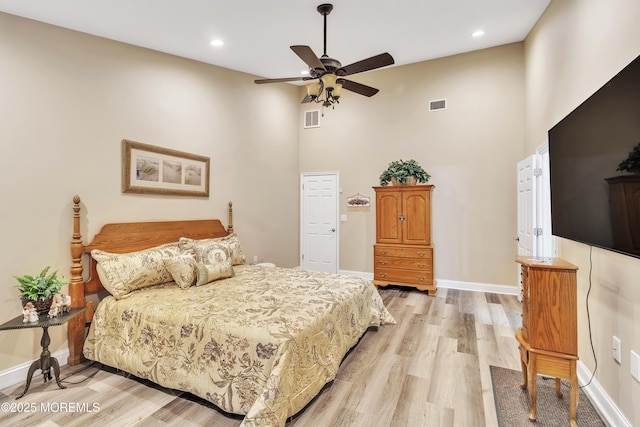 1792 Buttonwood Ave, Toms River, NJ 08755 - bedroom featuring visible vents, baseboards, light wood finished floors, and a towering ceiling