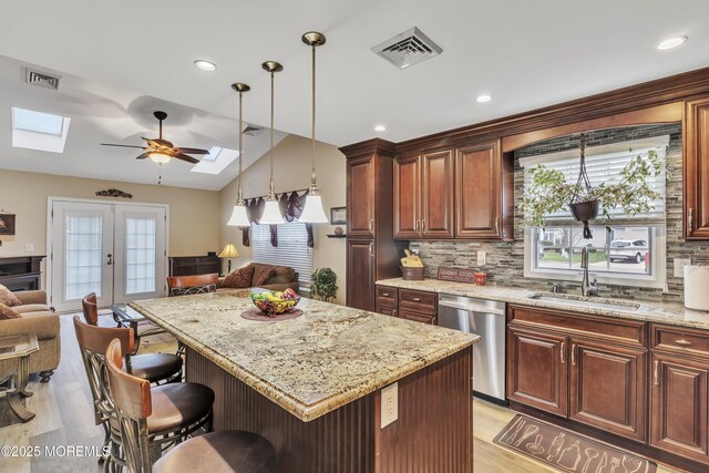 1792 Buttonwood Ave, Toms River, NJ 08755 - kitchen with stainless steel dishwasher, open floor plan, visible vents, and a sink