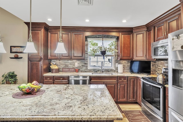 1792 Buttonwood Ave, Toms River, NJ 08755 - kitchen with tasteful backsplash, visible vents, a sink, appliances with stainless steel finishes, and light stone countertops