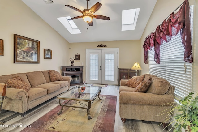 1792 Buttonwood Ave, Toms River, NJ 08755 - living area featuring high vaulted ceiling, wood finished floors, a ceiling fan, and a skylight