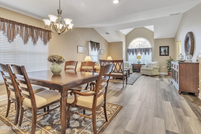 1792 Buttonwood Ave, Toms River, NJ 08755 - dining area with light wood-style floors, visible vents, lofted ceiling, baseboards, and a notable chandelier