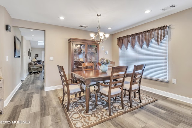 1792 Buttonwood Ave, Toms River, NJ 08755 - dining area featuring baseboards, visible vents, light wood-type flooring, and an inviting chandelier