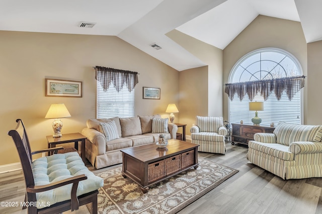 1792 Buttonwood Ave, Toms River, NJ 08755 - living room with wood finished floors, lofted ceiling, and visible vents
