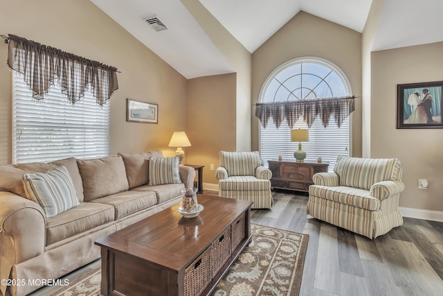 1792 Buttonwood Ave, Toms River, NJ 08755 - living room with visible vents, baseboards, vaulted ceiling, and wood finished floors