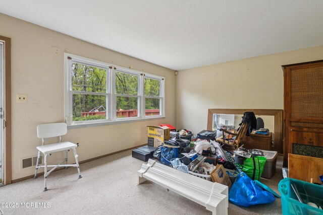carpeted bedroom featuring baseboards