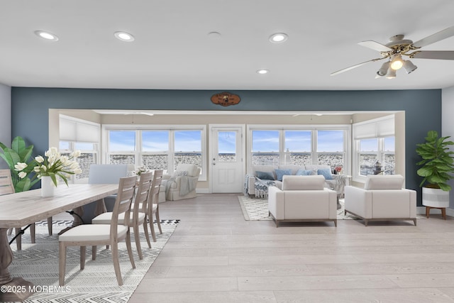 living room with recessed lighting, a ceiling fan, and light wood-style flooring