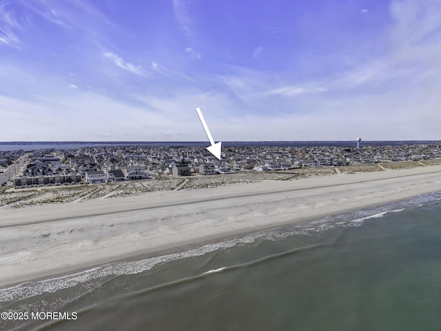 drone / aerial view with a water view and a residential view