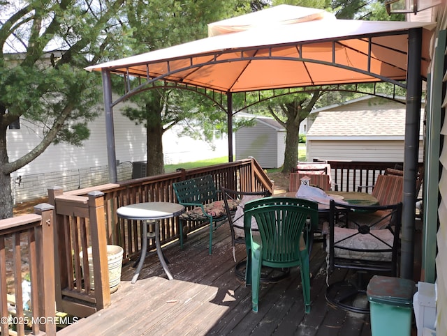 53 Pine Ridge Blvd, Whiting, NJ 08759 - wooden deck with a gazebo and outdoor dining space