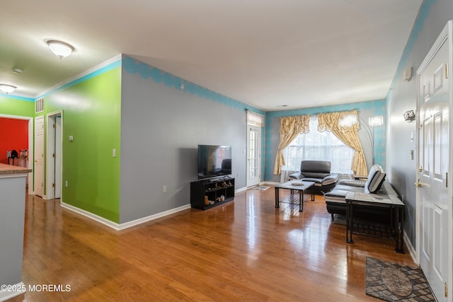 439 Sophee Ln, Lakewood, NJ 08701 - living area featuring baseboards, visible vents, ornamental molding, and wood finished floors