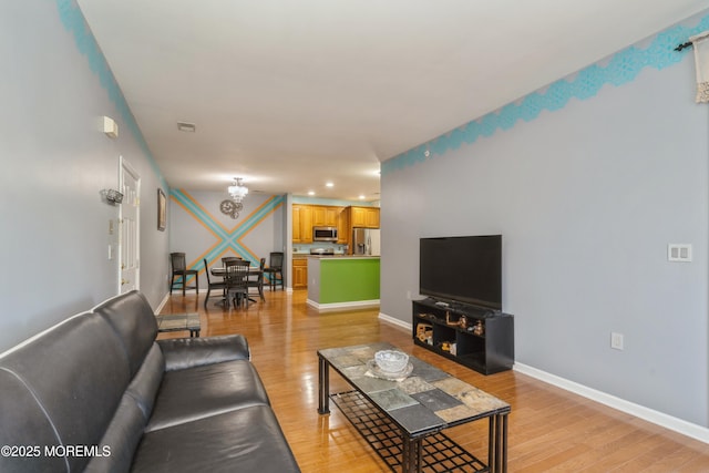 439 Sophee Ln, Lakewood, NJ 08701 - living area with baseboards, light wood-type flooring, recessed lighting, and an inviting chandelier