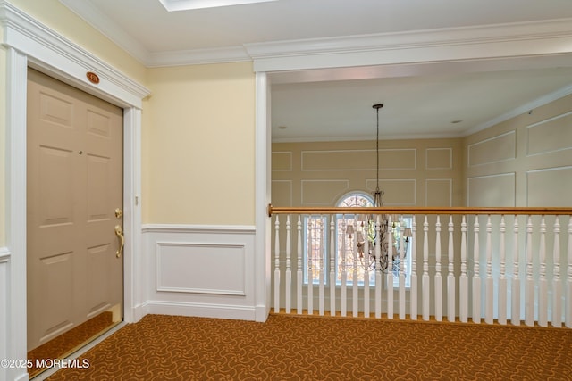 439 Sophee Ln, Lakewood, NJ 08701 - hall featuring a decorative wall, carpet floors, and a chandelier