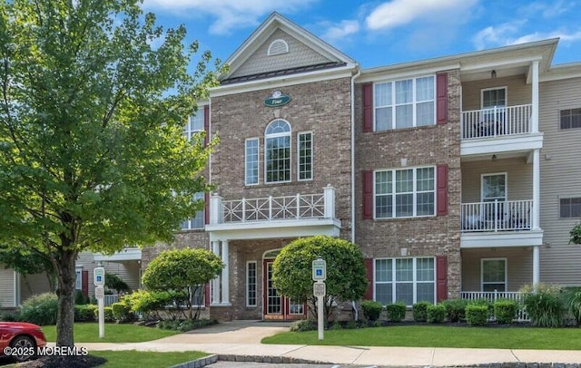 439 Sophee Ln, Lakewood, NJ 08701 - view of front facade with brick siding and a front lawn