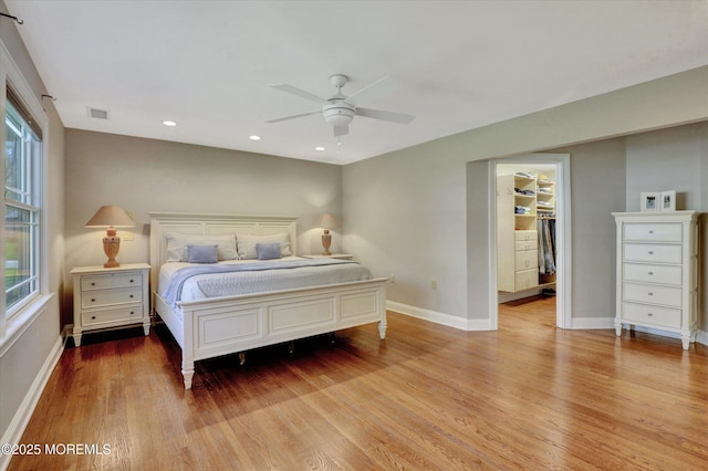 bedroom featuring visible vents, baseboards, recessed lighting, wood finished floors, and ceiling fan