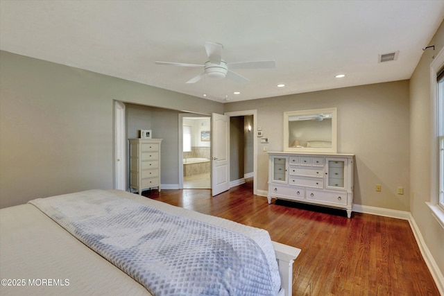 bedroom featuring ensuite bathroom, wood finished floors, baseboards, visible vents, and recessed lighting