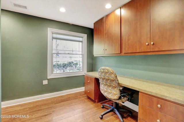 office area with recessed lighting, built in study area, visible vents, baseboards, and light wood-style flooring