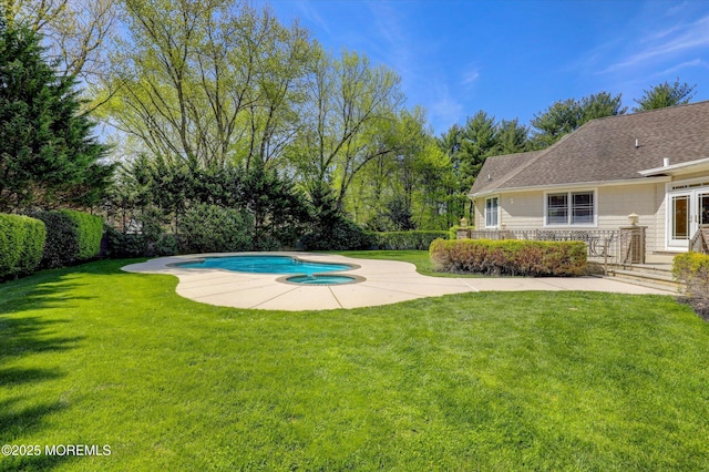 pool featuring a lawn and a patio