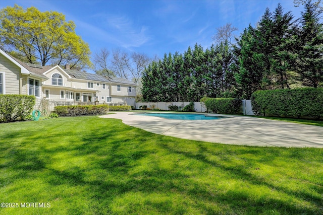 view of pool featuring a fenced backyard, a patio, a fenced in pool, and a lawn