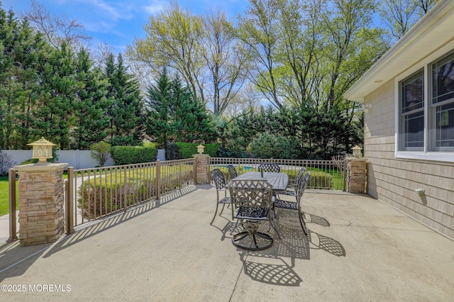 view of patio / terrace featuring outdoor dining space and fence