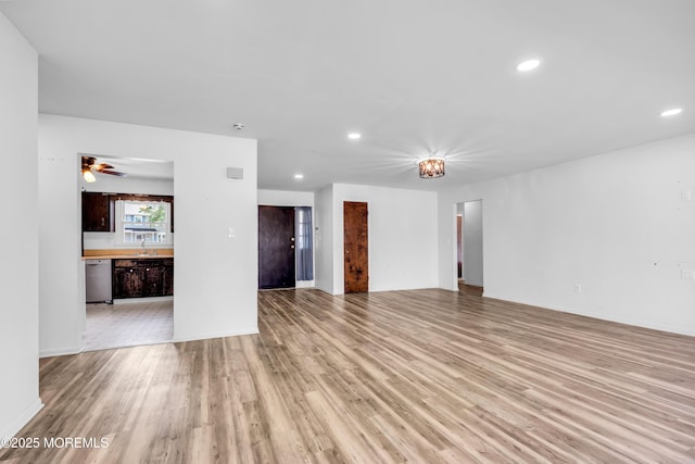 35 Tara Lin Dr, Hazlet, NJ 07730 - unfurnished living room with light wood finished floors, recessed lighting, ceiling fan, baseboards, and a sink
