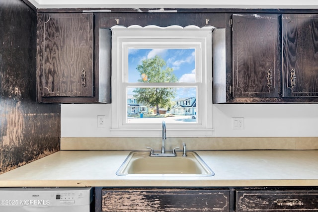 35 Tara Lin Dr, Hazlet, NJ 07730 - kitchen with white dishwasher, a sink, dark brown cabinetry, and light countertops