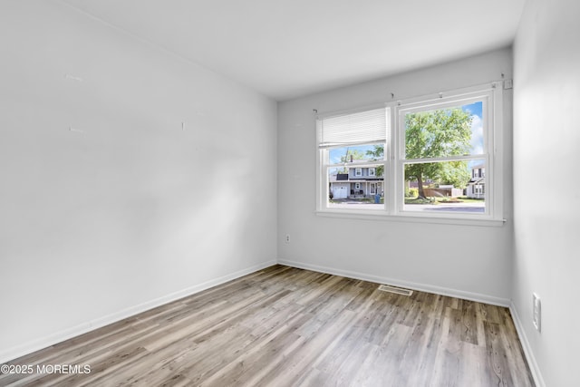 35 Tara Lin Dr, Hazlet, NJ 07730 - empty room featuring wood finished floors and baseboards