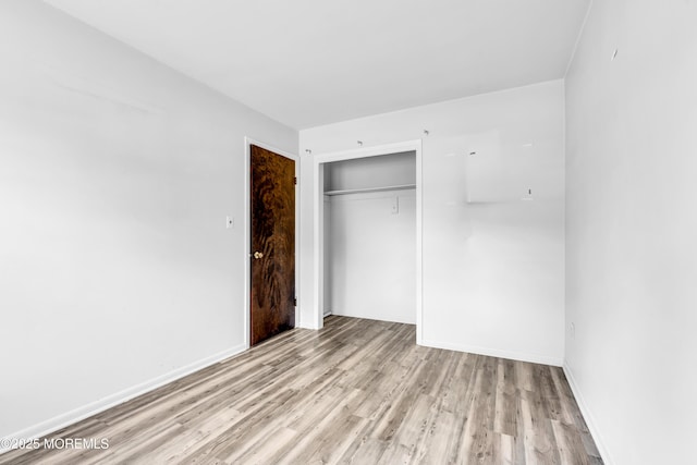 35 Tara Lin Dr, Hazlet, NJ 07730 - unfurnished bedroom with light wood-style floors, a closet, and baseboards