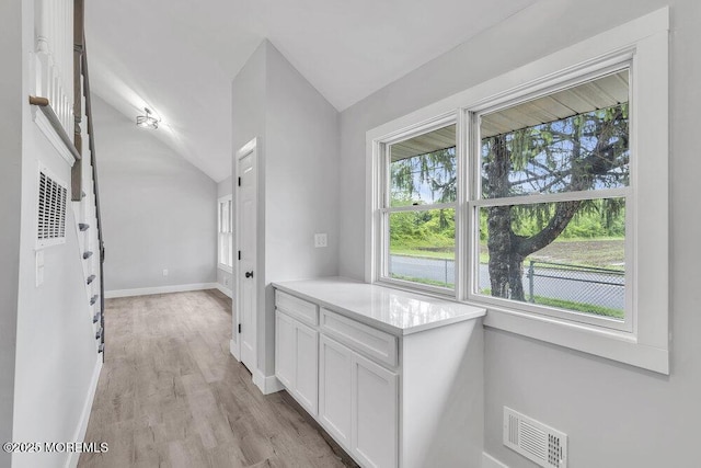 703 Stone Rd, Union Beach, NJ 07735 - hallway featuring vaulted ceiling, light wood finished floors, and baseboards