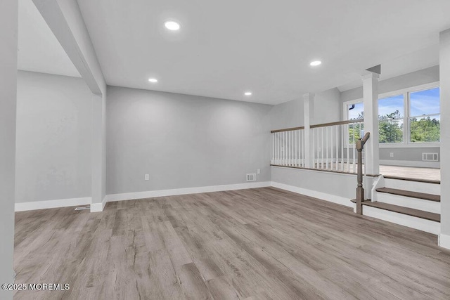 703 Stone Rd, Union Beach, NJ 07735 - spare room featuring wood finished floors, recessed lighting, baseboards, and stairs