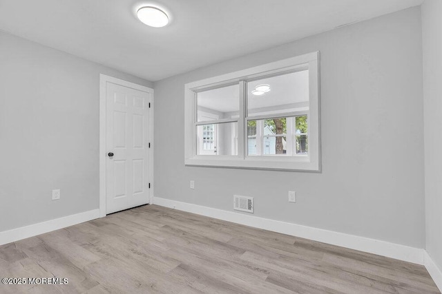 703 Stone Rd, Union Beach, NJ 07735 - unfurnished room with wood finished floors and baseboards