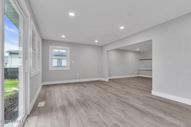 703 Stone Rd, Union Beach, NJ 07735 - unfurnished living room with light wood-type flooring, baseboards, and recessed lighting