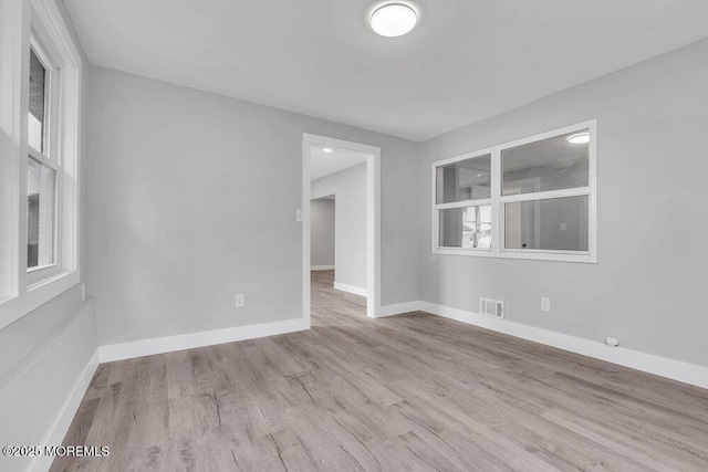 703 Stone Rd, Union Beach, NJ 07735 - unfurnished room with wood finished floors and baseboards