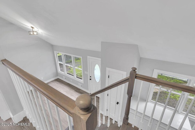 703 Stone Rd, Union Beach, NJ 07735 - stairway with baseboards, wood finished floors, and lofted ceiling