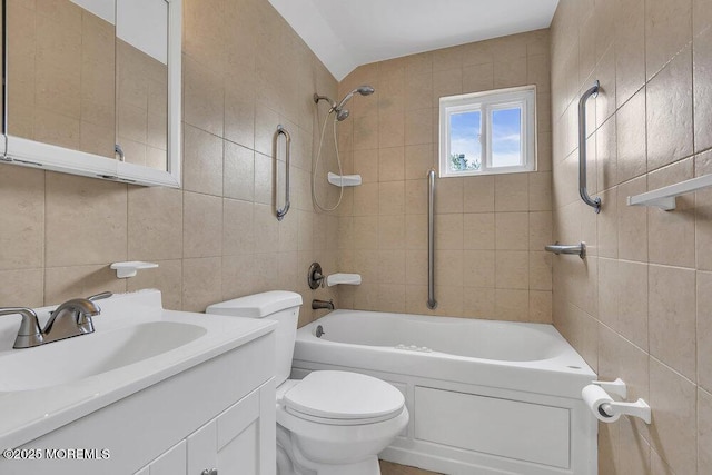 703 Stone Rd, Union Beach, NJ 07735 - bathroom featuring tile walls, washtub / shower combination, vanity, and toilet