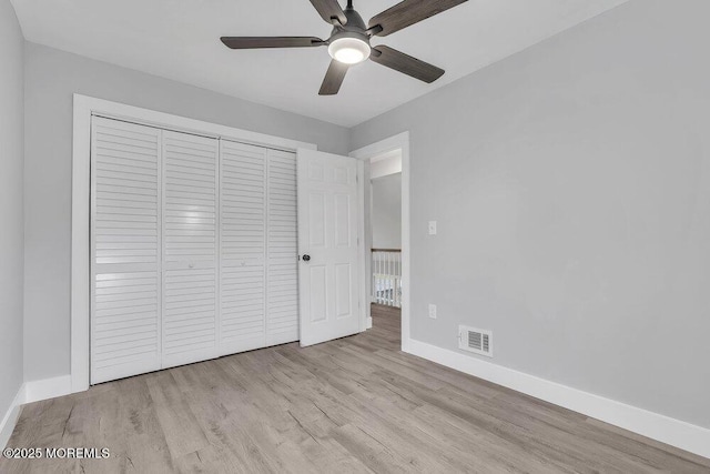 703 Stone Rd, Union Beach, NJ 07735 - unfurnished bedroom with baseboards, wood finished floors, and a closet