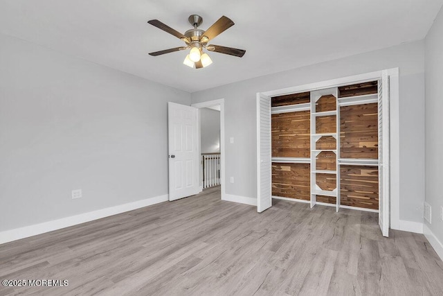 703 Stone Rd, Union Beach, NJ 07735 - unfurnished bedroom featuring wood finished floors, baseboards, a closet, and a ceiling fan
