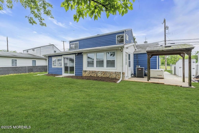 703 Stone Rd, Union Beach, NJ 07735 - back of house with central AC, a patio area, and stone siding